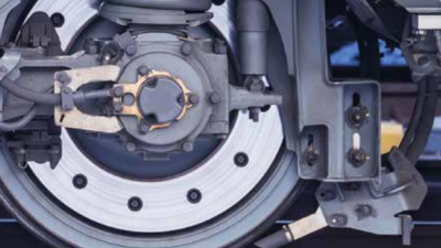 Close-up of a railway axlebox and suspension system, showcasing intricate mechanical components used for predictive maintenance and digital tracking